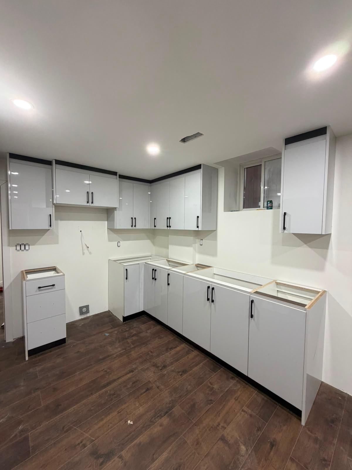 White cabinet install with black trim accent