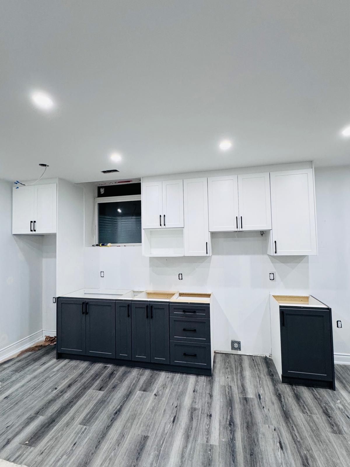 Two-tone navy and white kitchen install