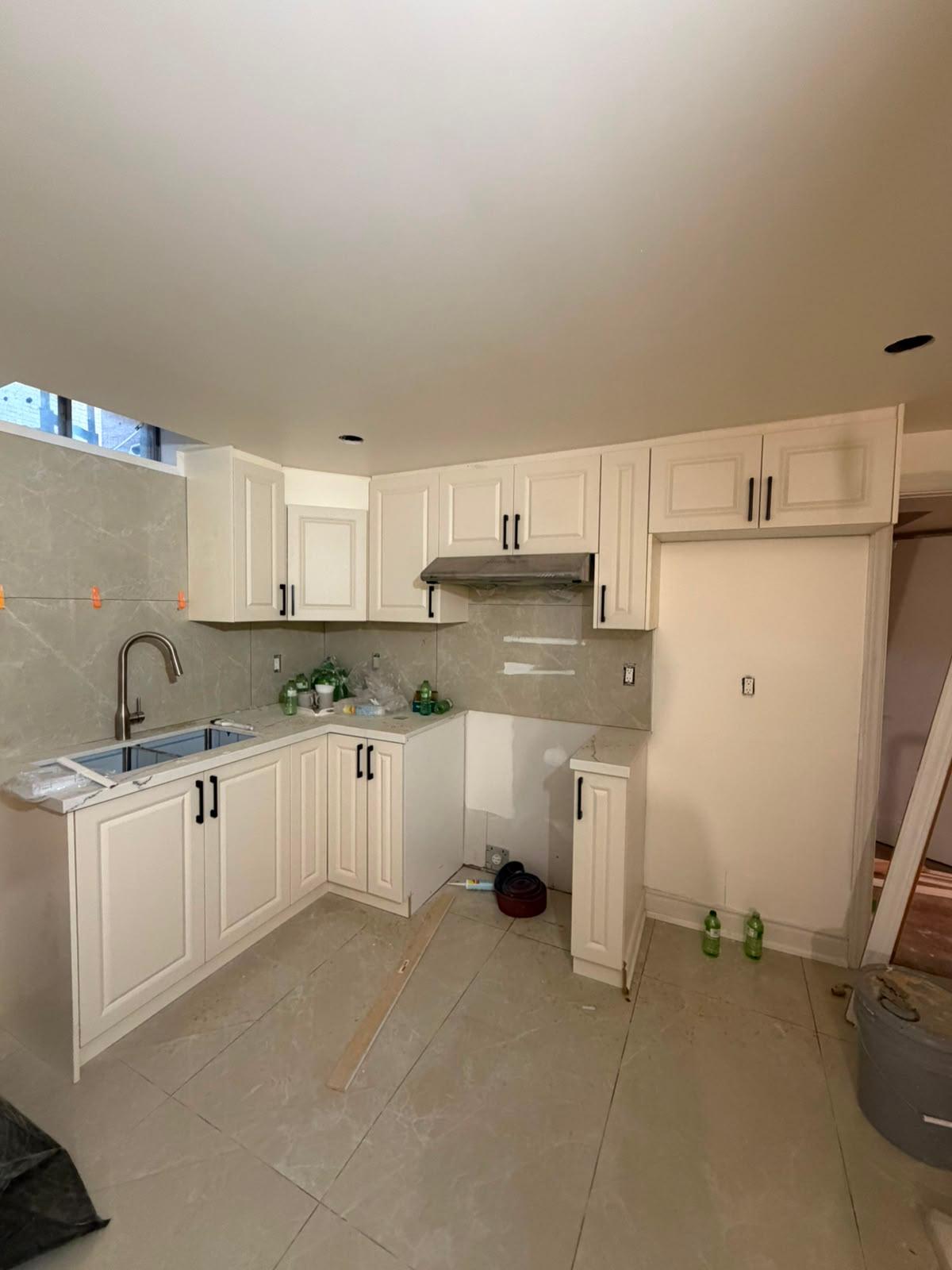 Traditional raised-panel cream cabinet kitchen